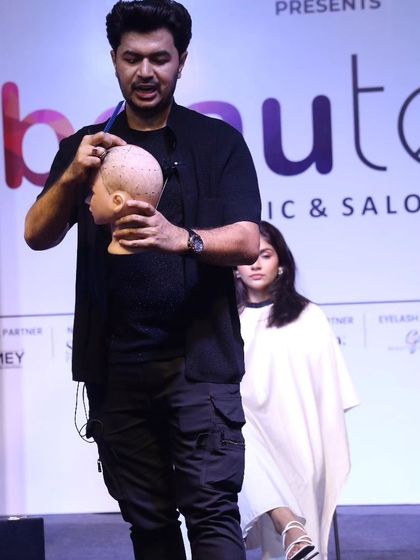 A shot of me in action, performing a live demo at the Beautech Cosmetic & Salon Expo in Mumbai. I love sharing my creative process and techniques on stage.