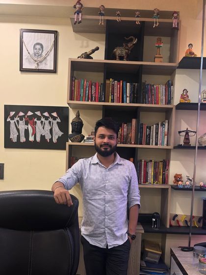 Standing in my cabin, surrounded by books and mementos that inspire me. Continuous learning is essential in the world of finance to provide the best tax advisory services.