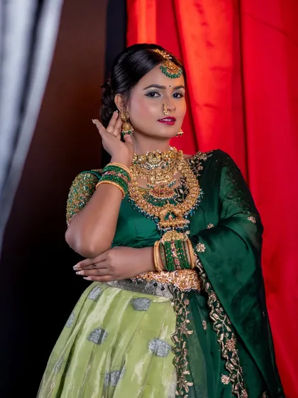 A three-quarter shot of the green lehenga look.