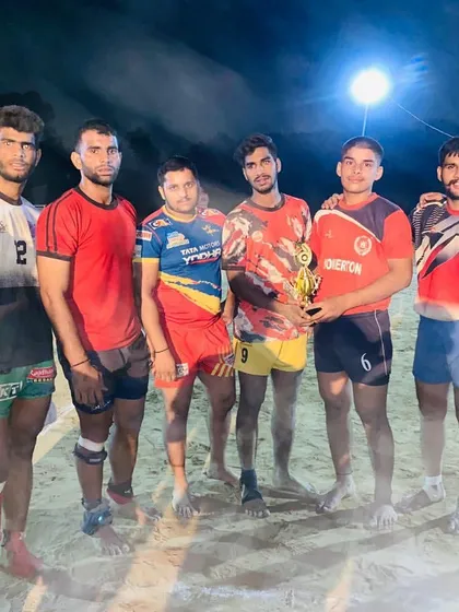 Every trophy tells a story of hard work. Our team celebrating a second-place finish in a tough night tournament, holding the trophy with pride.