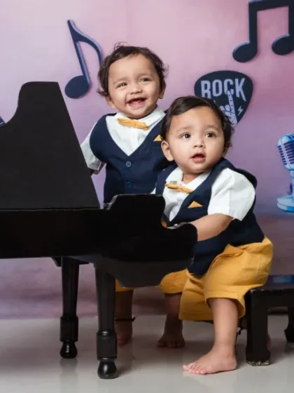 Double the cuteness, double the talent. These twin rockstars are ready for their first concert.