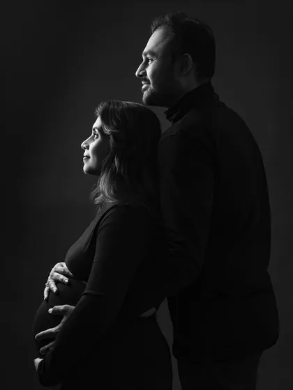 A classic couple portrait looking towards the future together. The use of shadow and light in this black and white shot creates a feeling of strength and unity.