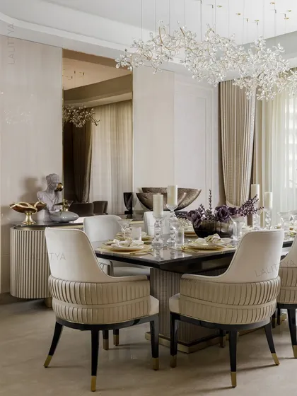 A gathering in grace. This dining area is designed for shared meals under a canopy of crystal bloom, with a fluted credenza and a large mirror reflecting the light and space.