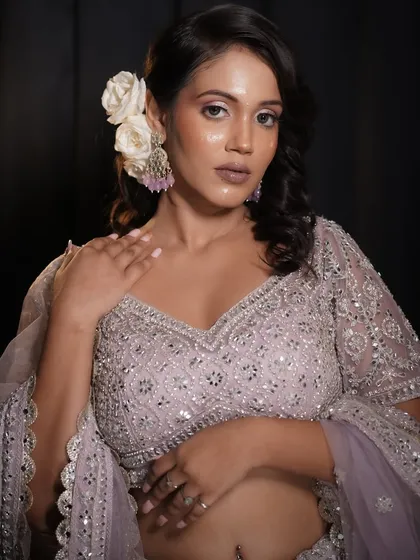 A full-body shot that captures the overall elegance of the look. The glowing skin makes the entire appearance more ethereal and sophisticated.