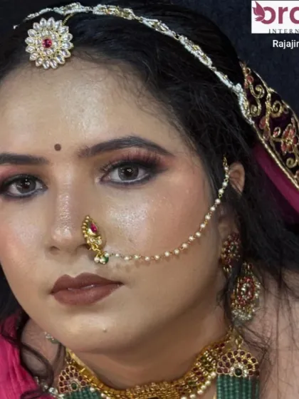 A close-up on the Rajasthani bridal makeup, focusing on the dramatic eye makeup and traditional nose ring (nath).