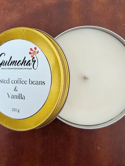 A top-down view of the coffee and vanilla tin candle. The clean, white soy wax is ready to release its beautiful fragrance.
