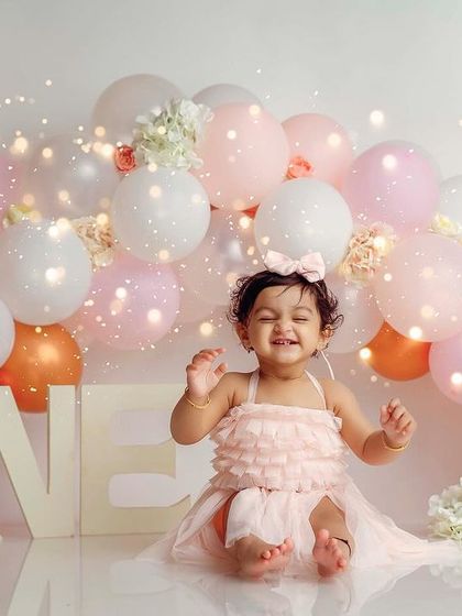 A happy, closed-eye smile shows just how much fun turning one can be.