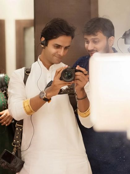 A quick check on the camera's screen to make sure we've captured the perfect emotion. These little moments of review during the shoot help us refine the poses and ensure the final images are exactly what you envisioned.