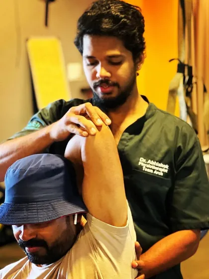 Dr. Abhishek performing a hands-on mobilization technique for a client's shoulder. His professionalism and empathy have earned him continuous positive feedback from patients.