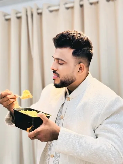 Another shot of a happy customer enjoying our biryani from one of our meal boxes. Our food is meant to be savored, and it brings us happiness to see you enjoy it.
