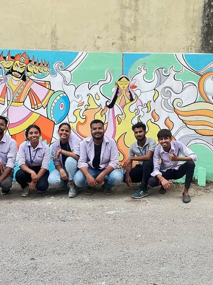 Here I am with my talented team after completing a large-scale Ramayan mural for an Arts College competition. This piece is full of vibrant colors and dynamic figures, capturing a classic story in a modern illustrative style. It shows how we handle big, detailed projects.