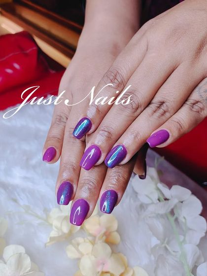 A gorgeous purple polish with a subtle blue-green iridescent shift, giving it a unique, multi-tonal look.