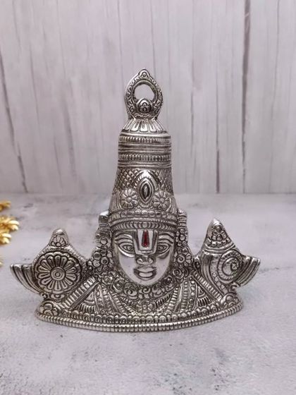 The same powerful Tirupati Balaji wall hanger, shown here in a classic antique silver finish, perfect for adding a divine touch to any wall.