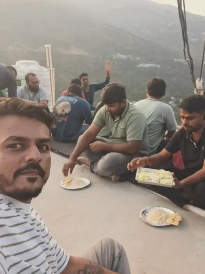 Sharing a meal with the group on a rooftop with mountain views. These simple moments are what make the trip special.