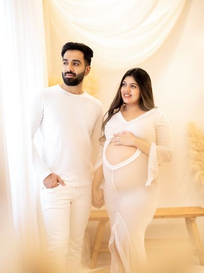 A classic portrait of the couple holding hands, showcasing their partnership as they embark on this new chapter.