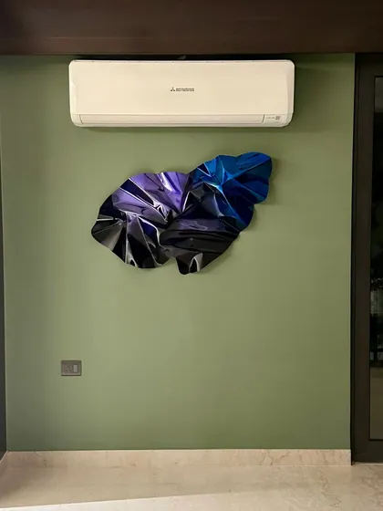 A custom Meteor piece in shades of indigo and violet, installed in a client's bedroom to create a calming yet dynamic focal point.