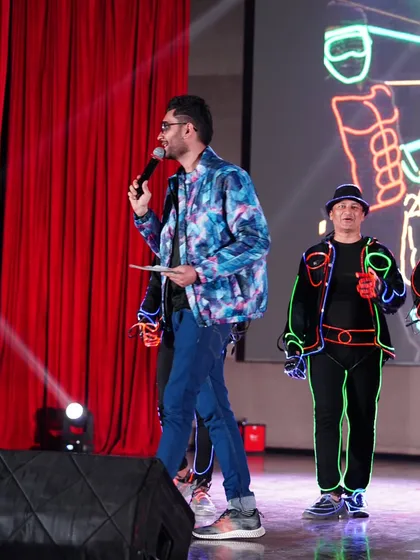 A side profile of me interacting with the performers on stage. Coordination with artists is key to a seamless show flow.