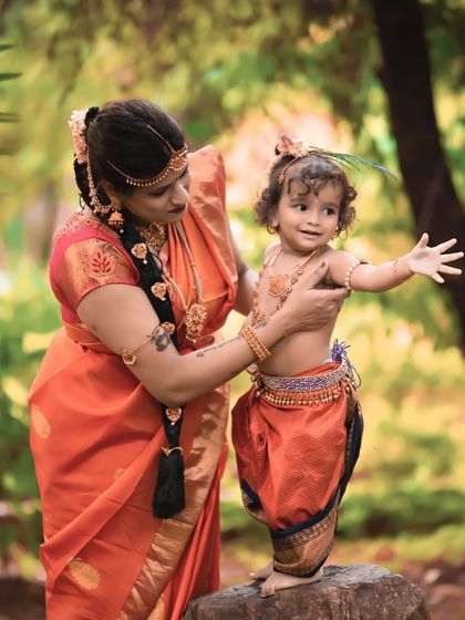 Guiding her little one. This photo captures the gentle and loving nature of their bond, set in a beautiful park in Bangalore.