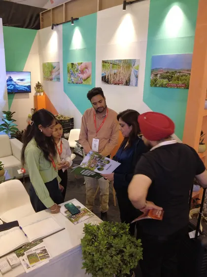 Explaining the details of our landscaping services to interested visitors at FOAID. Our brochures and project portfolios help clients visualize how we can transform their commercial and residential spaces.