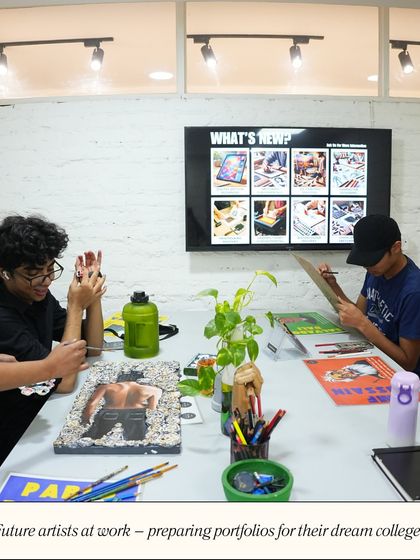 Future artists at work. This image captures the collaborative and focused atmosphere of the studio as students prepare their portfolios for their dream colleges.