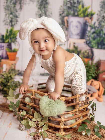 This little bunny is on the move! Capturing babies as they explore the set adds a sense of energy and curiosity to the photoshoot.