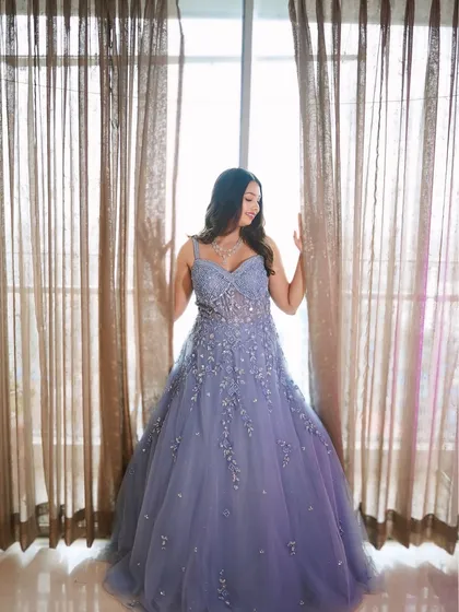 For your reception or cocktail, we can create something truly magical. This dreamy lavender gown is paired with soft, romantic makeup, proving that your bridal journey can be full of diverse and stunning looks.