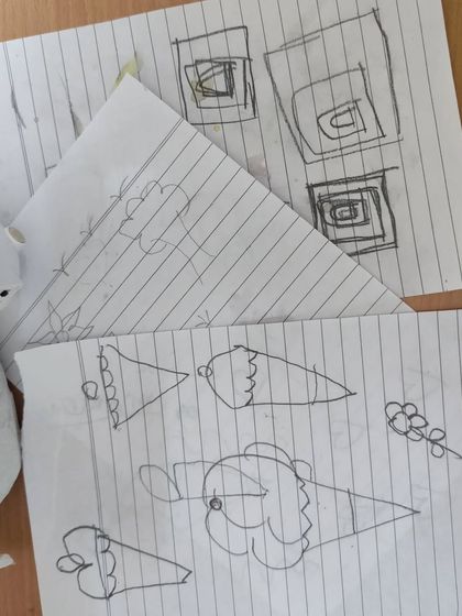 Every great design starts with a sketch. Before we even touch the paints, I help everyone brainstorm and draw their ideas on paper, planning out the design to make sure it looks great on the final product.