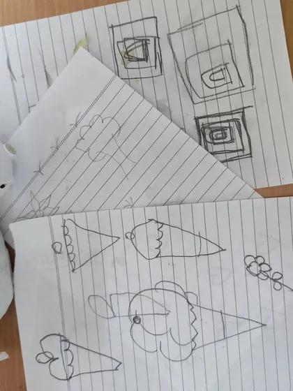 Every great design starts with a sketch. Before we even touch the paints, I help everyone brainstorm and draw their ideas on paper, planning out the design to make sure it looks great on the final product.