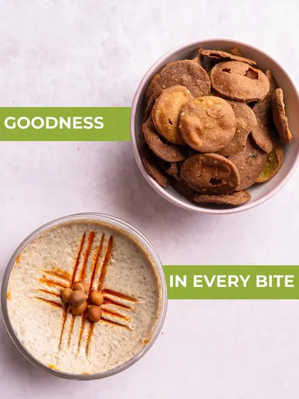 Goodness in every bite. This image showcases the perfect pairing of my Bajri Wada with creamy hummus, a quick and fulfilling snack combo.