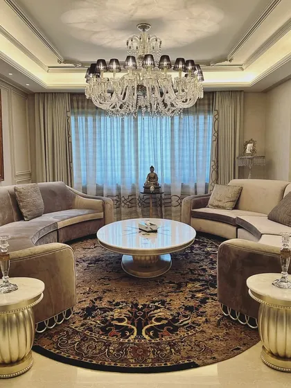 This living room was a special project, redesigned a decade after our initial work. We upcycled many original high-quality pieces, blending them with new elements to create a fresh yet familiar space that tells the continuing story of the homeowners' lives and aspirations.
