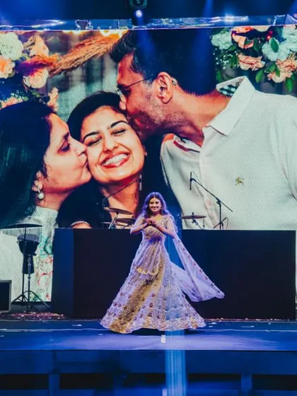 A daughter is her mother’s treasure and her father’s little angel. This heartwarming performance by the bride was dedicated to her parents, with their photo on the giant screen behind her.