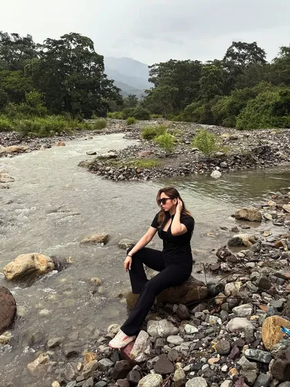 Showing my explorer side with this serene moment by a river in Jim Corbett. This type of content connects with audiences looking for nature getaways and showcases my ability to create beautiful travel stories in any setting.