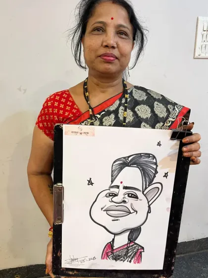 A guest at the Barwani wedding with her caricature. It's a wonderful keepsake to take home from the celebration.