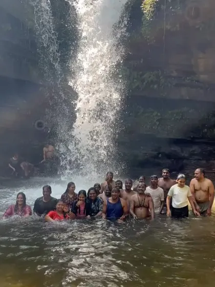 Our group taking a dip in a waterfall pool during the Netravathi trek, a perfect break during the hike.