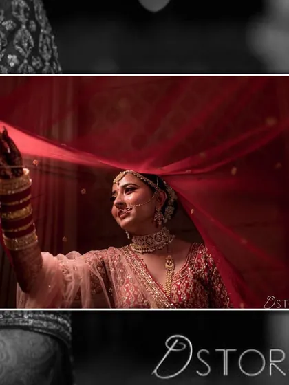 A candid moment of joy. Here you can see how the jewellery, from the maang tikka to the bangles, works together to frame the bride's face and complete her look under her veil.