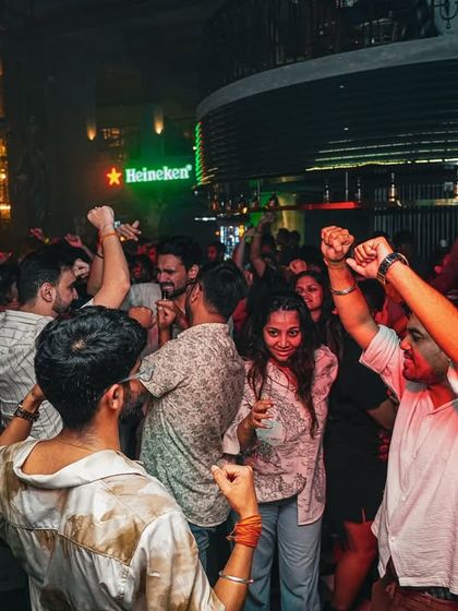 Hands up for the weekend! This shot captures the pure, unfiltered joy of a crowd letting loose to some heavy basslines and throwback tracks.