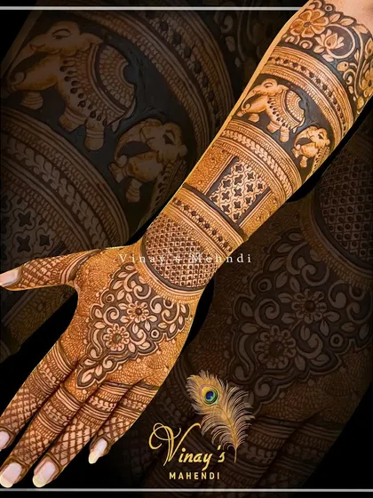 A floral-themed back-of-hand design with bands of elephants and flowers, creating a soft and feminine look.