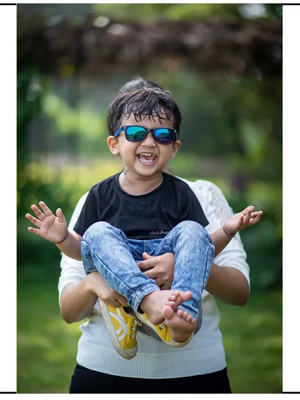 A moment of pure joy during a family outdoor session. Capturing kids laughing and playing freely is what makes outdoor photography so special.