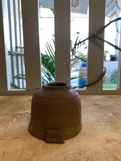 A small house-shaped pot, another example of the creative forms our students come up with.