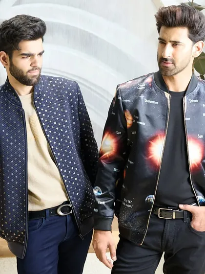 Another look at the two bomber jackets, highlighting their unique prints and how they can be styled for a modern, fashion-forward aesthetic.