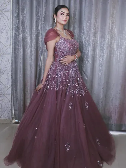 This gown makes a statement from every angle. The color is unique and the sparkle is undeniable.