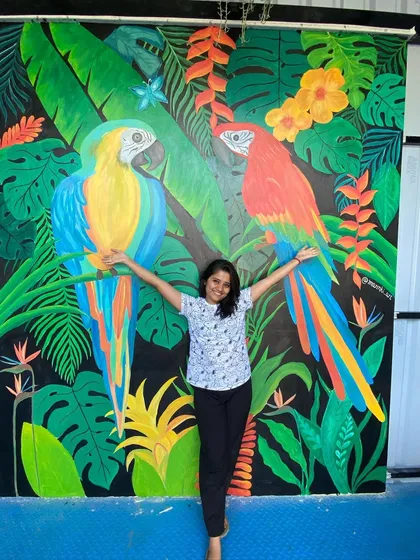 This vibrant tropical mural featuring two large macaw parrots was a joy to create. The bold colors and dense foliage on a black background make for a dramatic and stunning photo point in a restaurant.