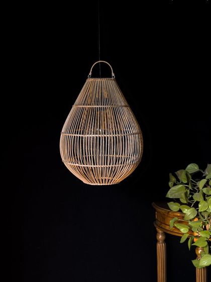 Unlit, this teardrop pendant showcases its graceful silhouette and the fine craftsmanship of its bamboo frame. The small loop at the top is a practical and charming detail.