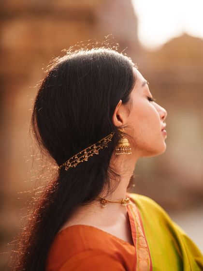 A sun-kissed profile shot, capturing a moment of peace. This highlights my ability to work with natural light to create beautiful, warm images.