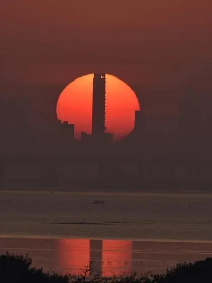 A different kind of Mumbai sunset. I love finding these unique compositions where the setting sun perfectly aligns with the city's architecture, creating a powerful silhouette.