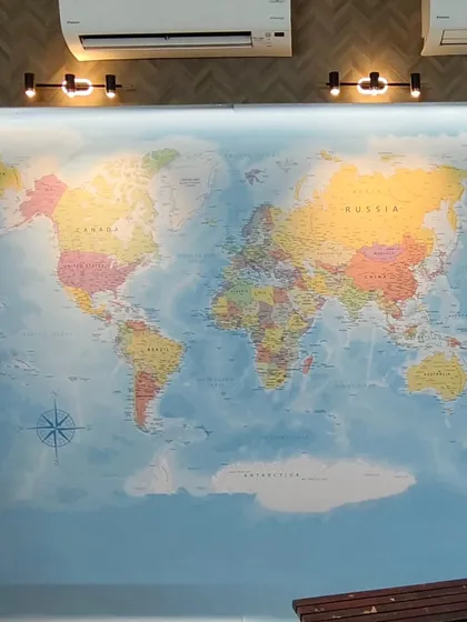A world map mural is a classic choice for corporate offices, especially for companies with a global presence. I make sure to work around AC units and lights for a clean look.