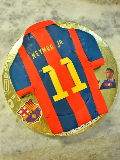 A cake for a die-hard Neymar Jr. fan, shaped and decorated like his number 11 FC Barcelona jersey.