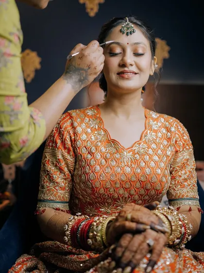 Here I am applying the final touches to the eye makeup. My students learn through observation and then get to replicate the looks with my guidance.