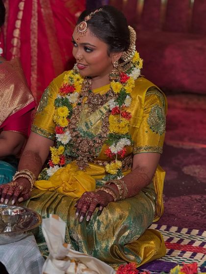 Another candid moment from Prithivi's wedding day. Her makeup looks just as stunning in profile, highlighting her joy and the festive atmosphere of the celebration.