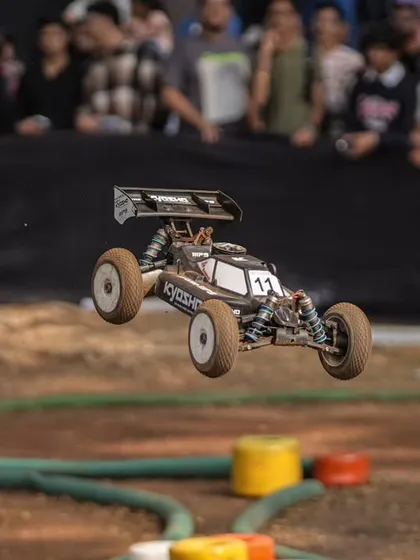 Capturing the peak action at the 'International Full Throttle' RC car racing event. My commentary brings these moments to life for the audience.